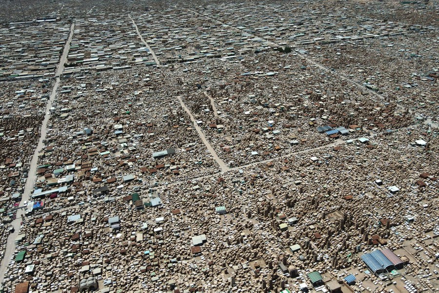 A vast cemetery filled with gravestones and crypts