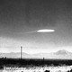 A photo of a UFO-shaped object in the sky