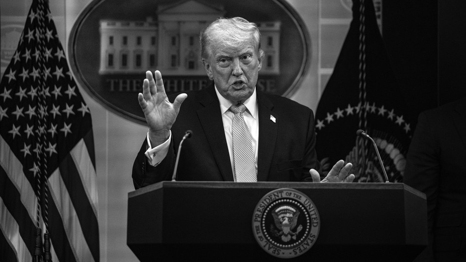 Black-and-white photo of Donald Trump speaking at a podium during a White House press conference.