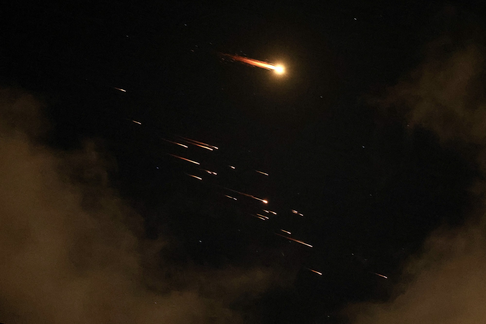 Missile trails streak through the sky above Israel.