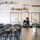 A man eating in an empty restaurant in Boston.