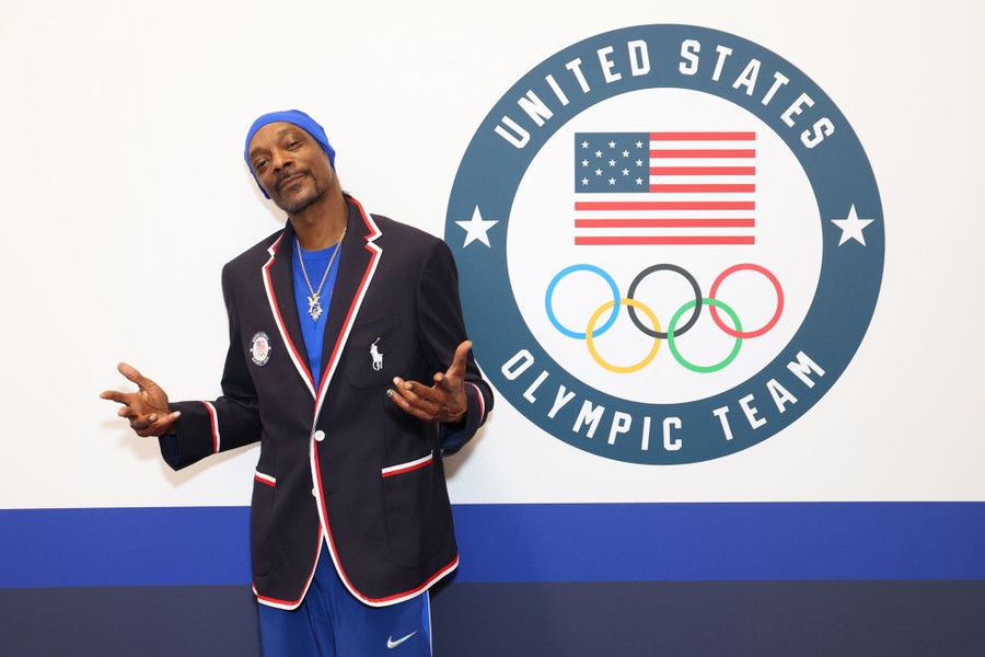 Snoop Dogg poses while wearing a Team USA blazer.