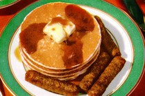 Photograph of pancakes and sausage on a plate