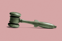 A gavel with a handle shaped like a bomb