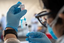 A health-care worker prepares a Moderna COVID-19 vaccine in San Francisco, March 1, 2021