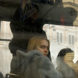 A young woman looks out a bus window in St. Petersburg, Russia.
