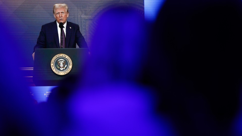 Color photograph of Donald Trump speaking at a podium featuring the presidential seal.