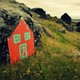 A painted "elf door" leans against rocks near the Icelandic town of Selfos.