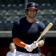 Former NFL quarterback Tim Tebow smiles during a workout for baseball scouts and the media during a showcase at the University of Southern California on August 30, 2016.