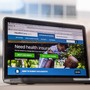 A laptop screen showing the HealthCare.gov website