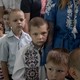 Young students return to school in the village of Savyntsi.