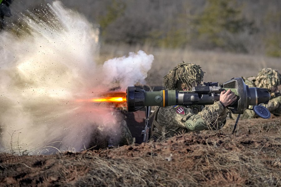 A soldier fires a shoulder-held anti-tank weapon during an exercise.