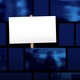 A placard in front of TV screens showing blurred images