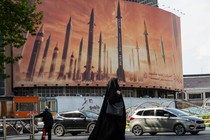 A photo of a billboard in Tehran that shows missiles