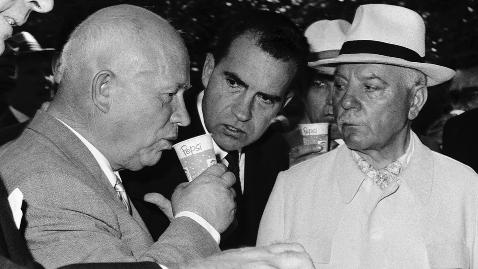 Nikita Khrushchev sips a cup of Pepsi