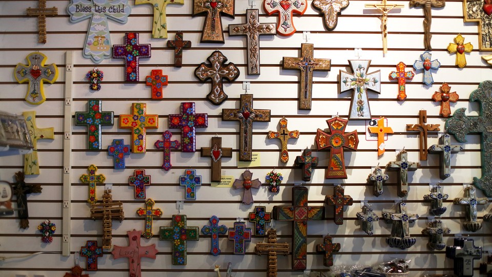 Colorful crucifixes decorate a gift shop wall.