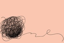 illustration of a tangled mass of string on a peach background
