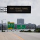 A road sign reads, "Port Miami tunnel closed."