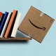 An illustration of books pushing an Amazon box off the shelf