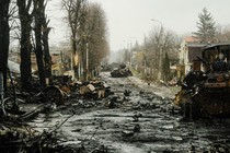 A  street strewn with destroyed tanks and debris