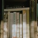 A vertical row of books surrounded by books in horizontal arrangements