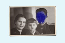 A family photograph with one person's face crossed out