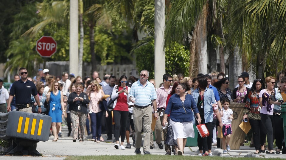 People evacuate a Jewish Community Center and day school in Florida on February 27. This particular community center was not among those Juan Thompson allegedly threatened.