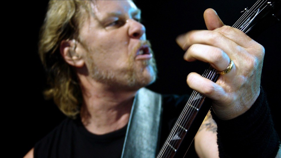 James Hetfield plays guitar onstage