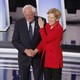Senators Bernie Sanders and Elizabeth Warren greet each other on the debate stage in Houston, Texas.
