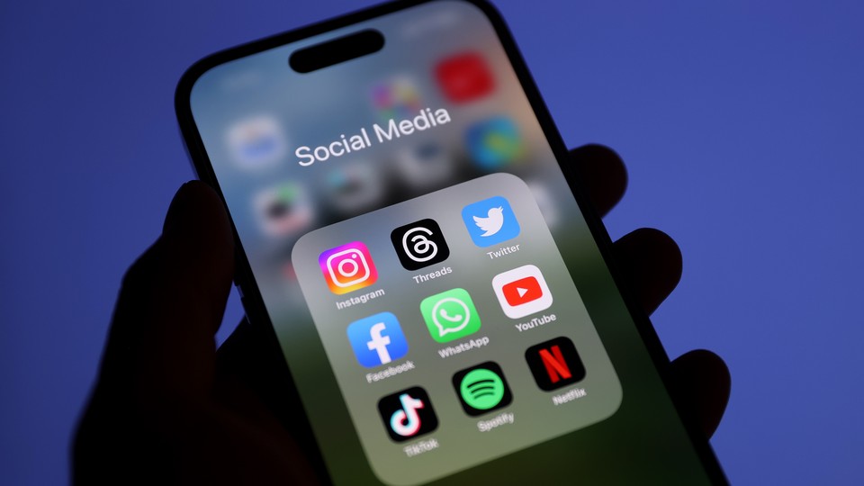 In this photo illustration, logos of Threads, Instagram, Facebook, WhatsApp, YouTube, TikTok, Spotify, Netflix and Twitter is displayed on a mobile phone screen