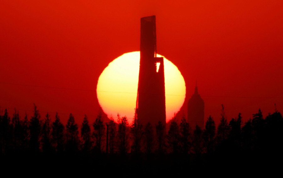 A view of distant skyscrapers seen during a sunset