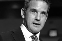 Adam Kinzinger in black and white