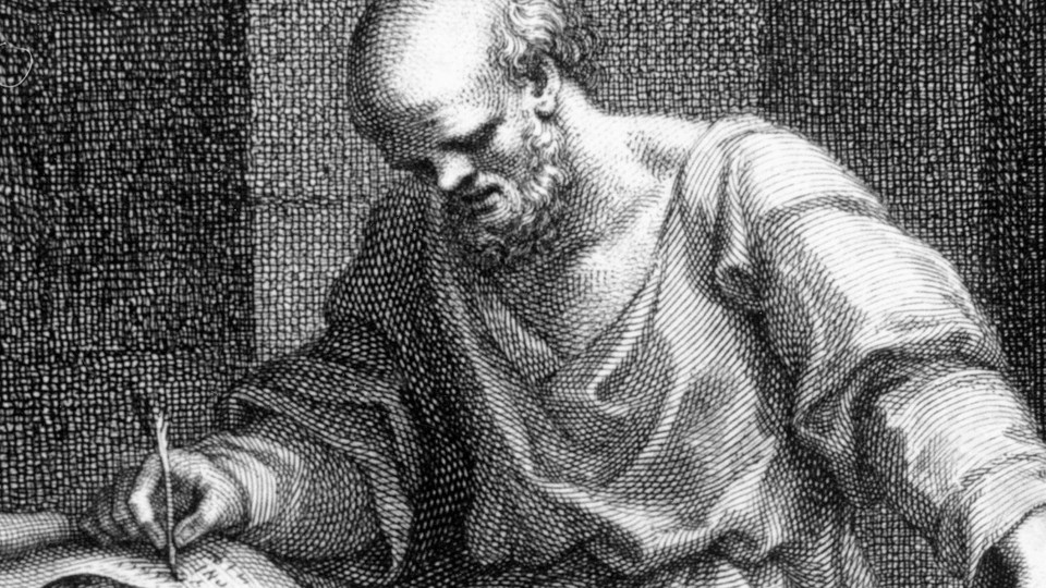 A black-and-white image of Socrates writing