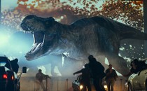 A Tyrannosaurus rex rampaging through a parking lot in "Jurassic World: Dominion"