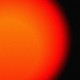 A giant red sun takes up most of the frame, with a tiny Earth in the foreground