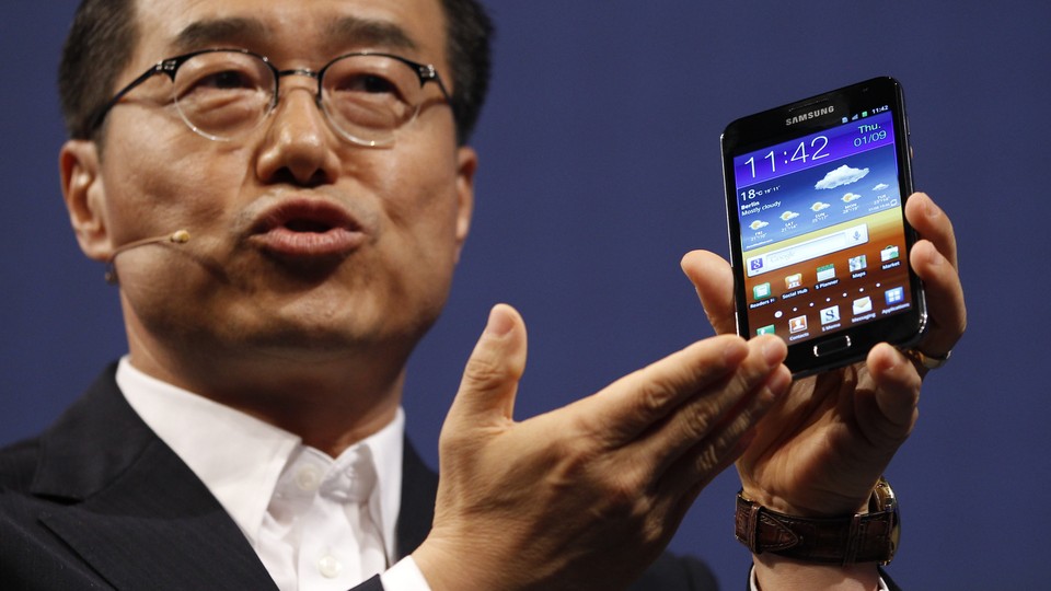 DJ Lee of Samsung presents Galaxy Note tablet PC during press day at IFA consumer electronics fair.