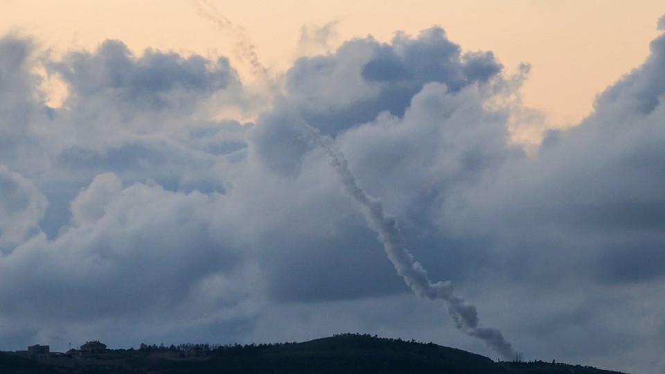 A photograph taken from the southern Lebanese area of Marjeyoun shows trails of rockets fired from Lebanon towards Israel