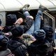 Police officers detain an opposition supporter during a rally in Vladivostok, Russia.