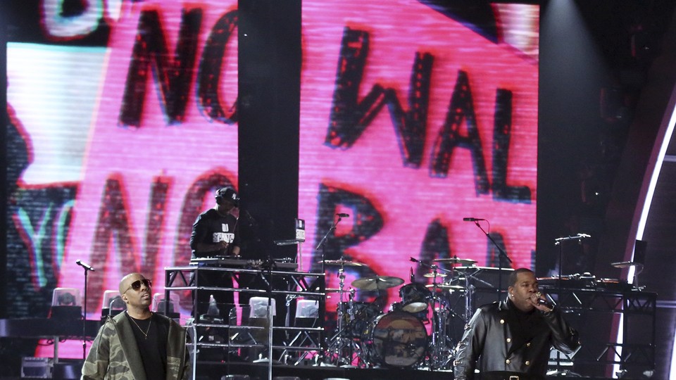 A Tribe Called Quest perform with anti-Trump imagery at the Grammys