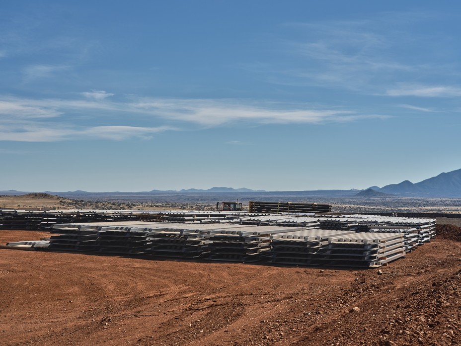 Steel bollard panels lay on the ground near the U.S.-Mexico border wall in the San Rafael Valley.