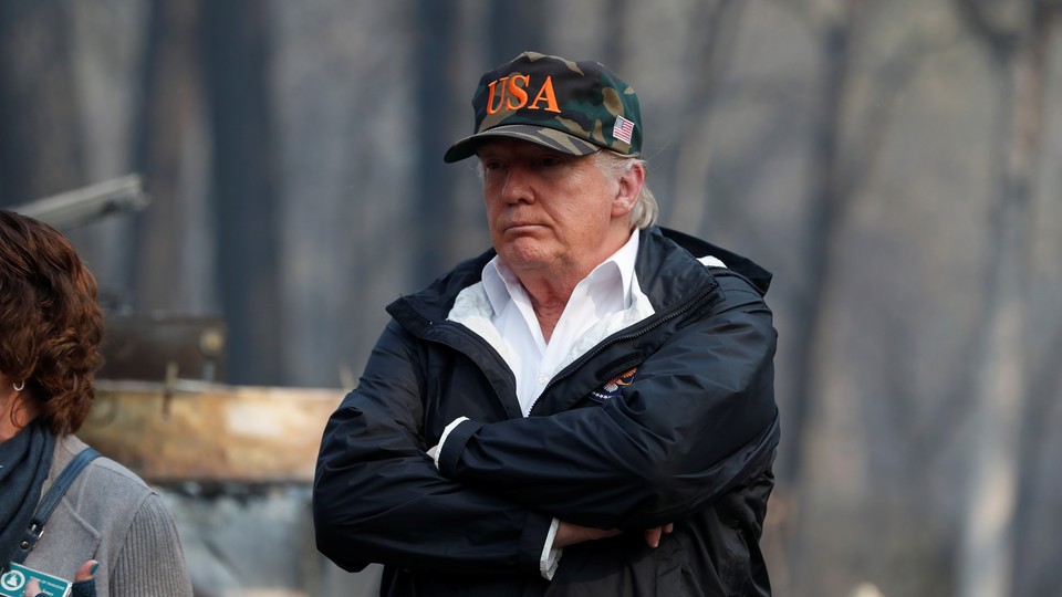 President Donald Trump visits the charred wreckage of Skyway Villa Mobile Home and RV Park in Paradise, California, on November 17, 2018.