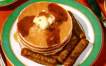 Photograph of pancakes and sausage on a plate