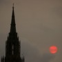 The sun sets behind the Houses of Parliament in London on October 16, 2017. 