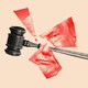 A photo illustration of a gavel smashing a portrait of Donald Trump.