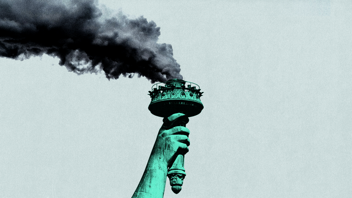 The Statue of Liberty's torch has dark smoke pouring out of it
