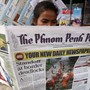 A woman reads The Phnom Penh Post in Cambodia