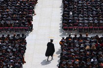 A college graduate walking down the aisle