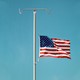 Illustration: American flag at half-mast on an IV stand