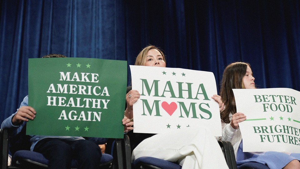 An image of three women holding pro-MAHA signs.