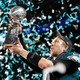 The Philadelphia Eagles' Nick Foles celebrates with the Vince Lombardi Trophy after winning Super Bowl LII